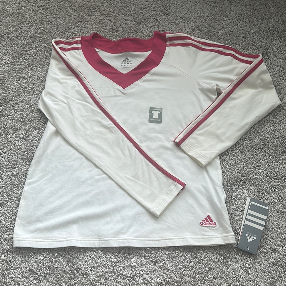Adidas white and dark pink women’s training Medium Longsleeve shirt.